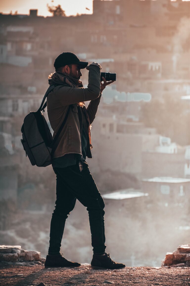 Male photographer working in a dry, dusty area.