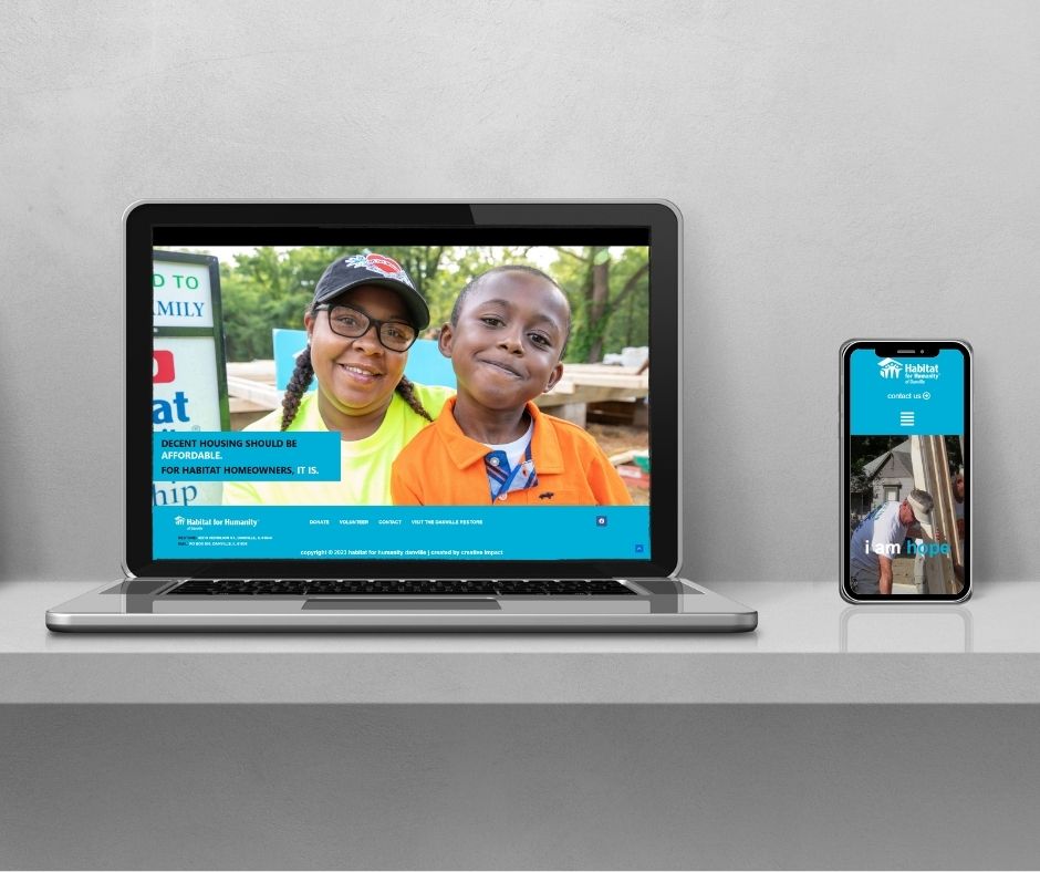 Laptop and cell phone displaying a custom web design for Danville Habitat for Humanity.